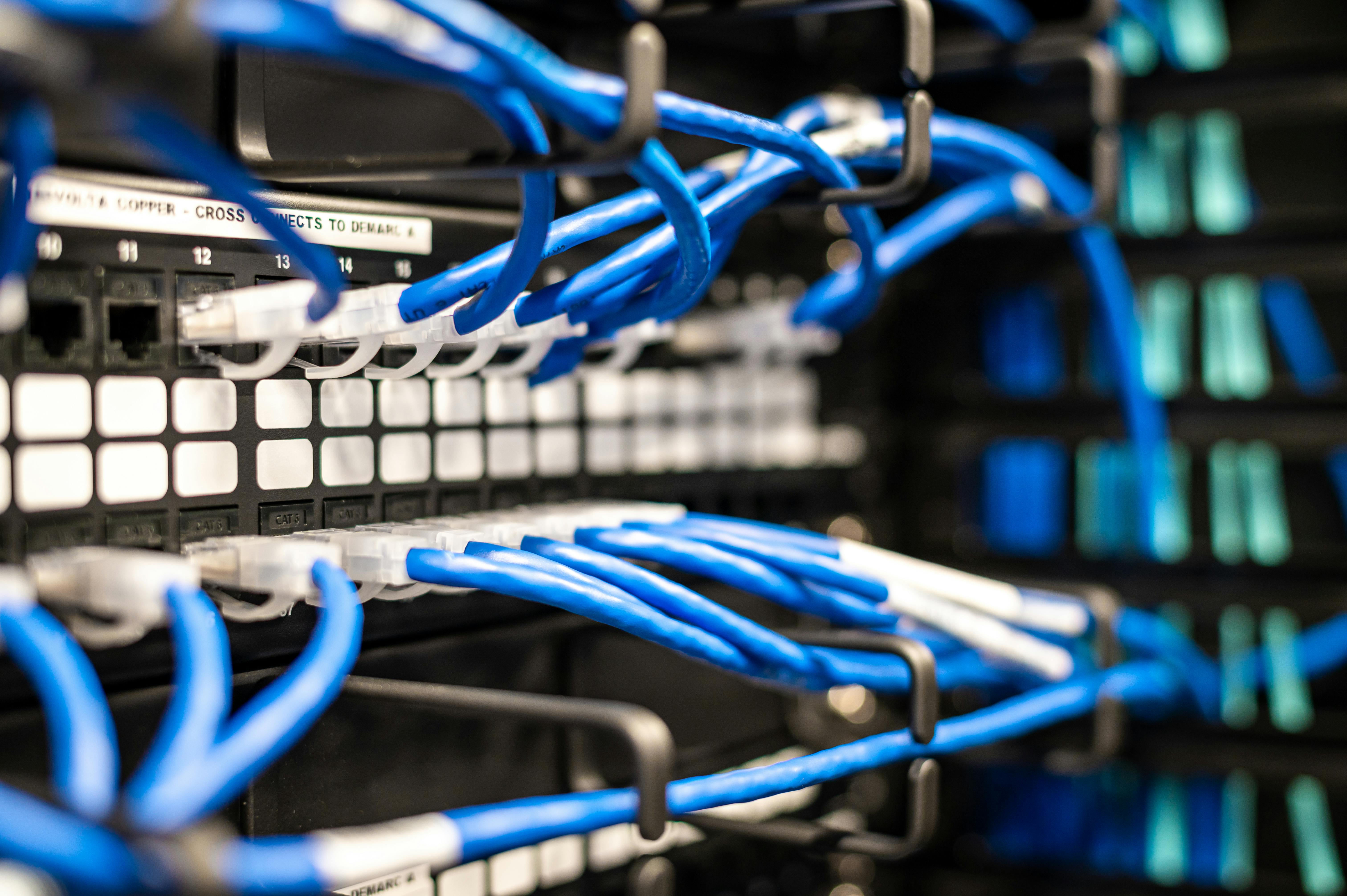 A neatly cabled network rack with patch panels and Cat 6A copper terminations